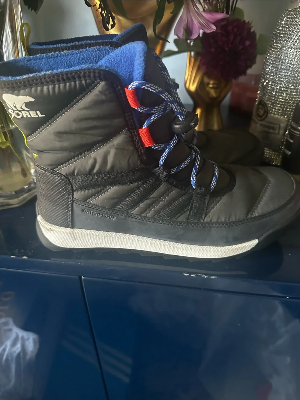 Sorel Kids Black Winter Boots with Blue Laces and Red Accents